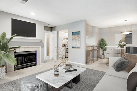 a living room with a fireplace and a tv